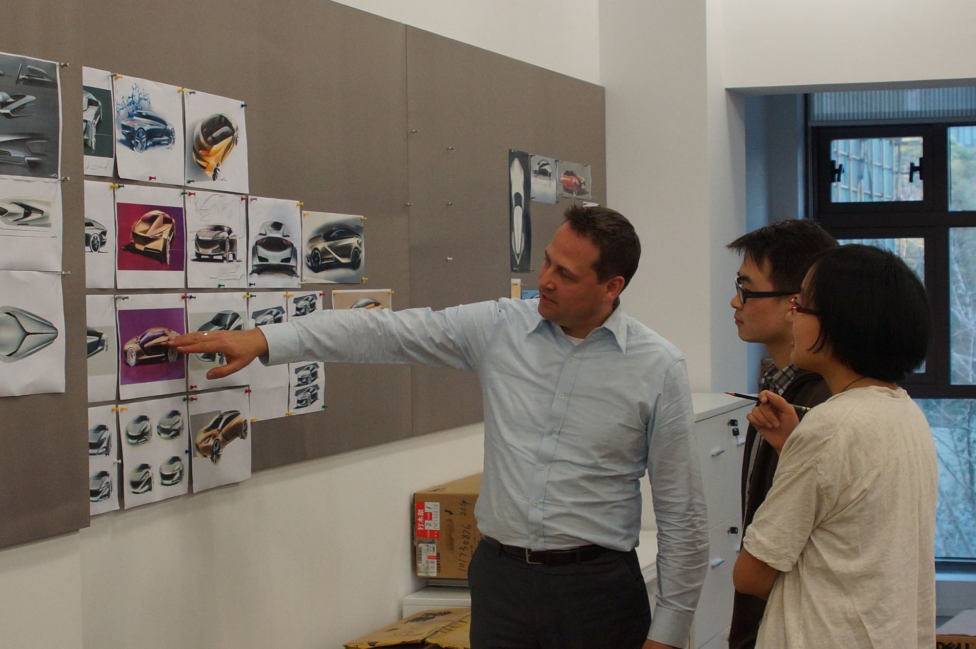Design review at the wall with the Shanghai team