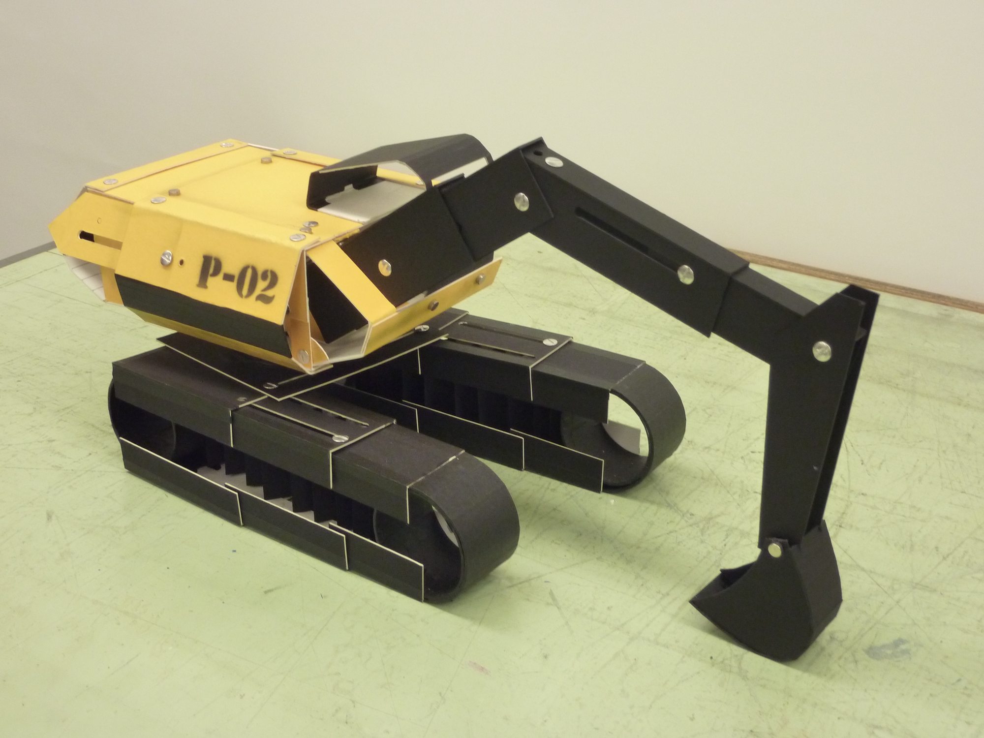Student cardboard model of an excavator